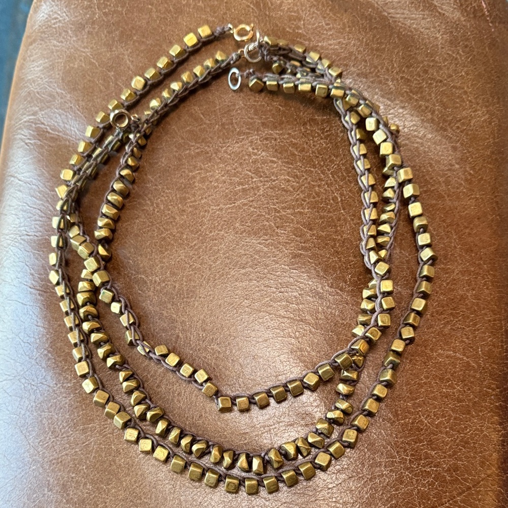 3 strands of Marisa Haskell brass and leather necklaces
